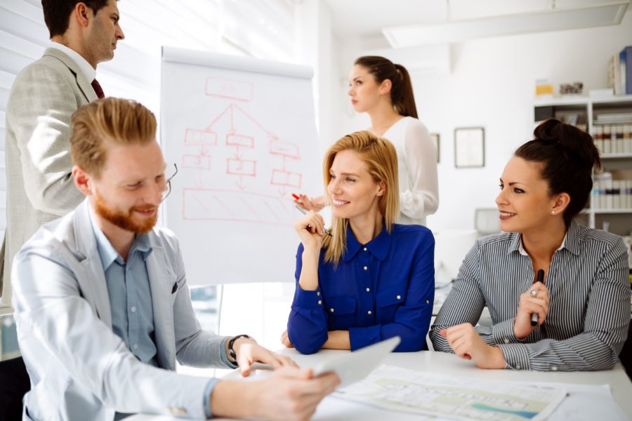 Happy business people brainstorming in office